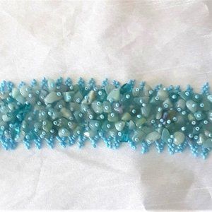 Bracelet. Turquoise color beads with stones.